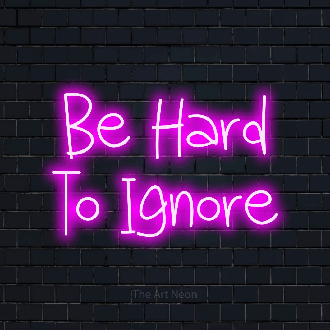 "Be Hard To Ignore" neon text design on a black brick wall