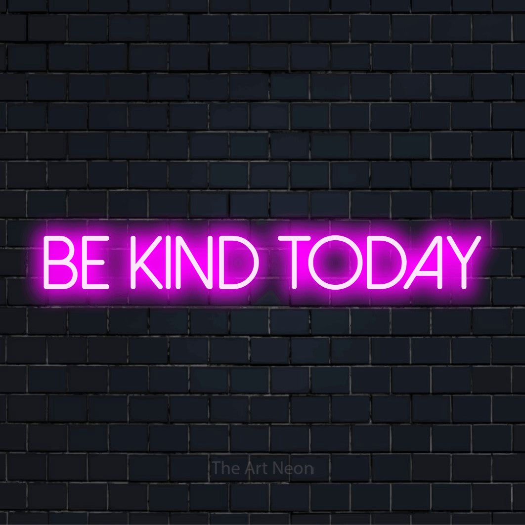 "Be Kind Today" LED neon sign on a black brick wall