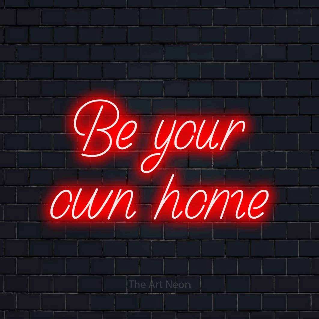 "Be Your Own Home" text design with neon effect on a black brick wall