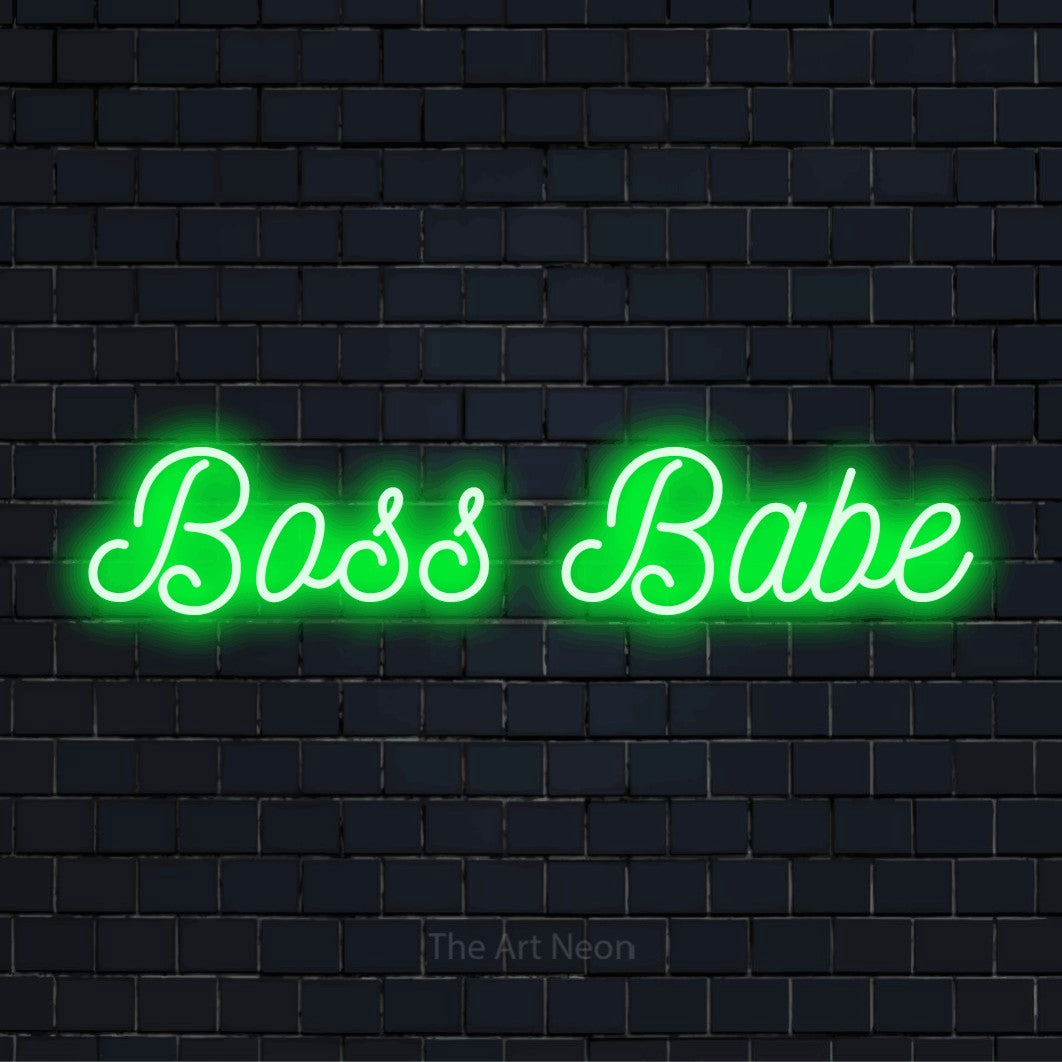 "Boss Babe" glowing LED neon sign on a black brick wall
