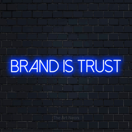 "Brand Is Trust" neon text design on a black brick wall