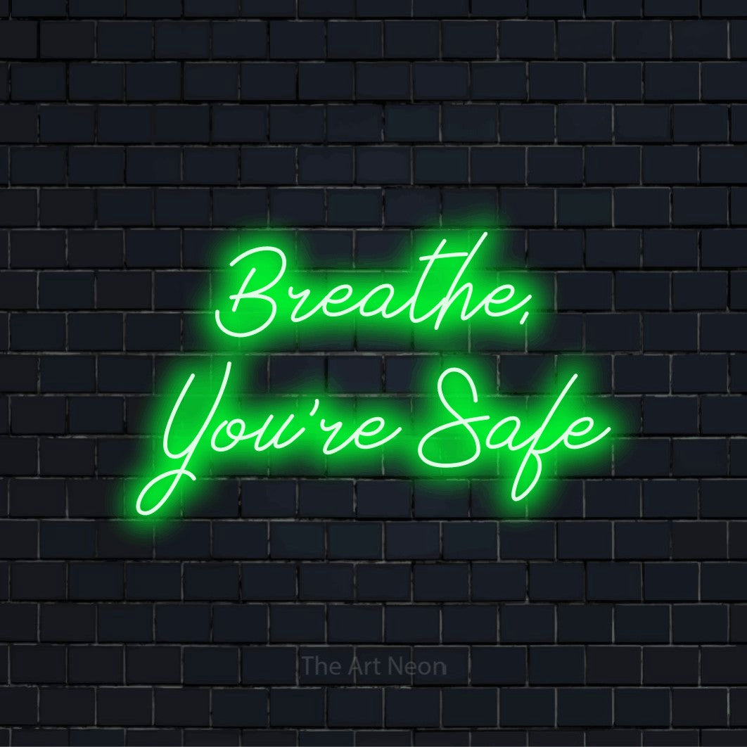 "Breathe, You’re Safe" text design with neon effect on a black brick wall