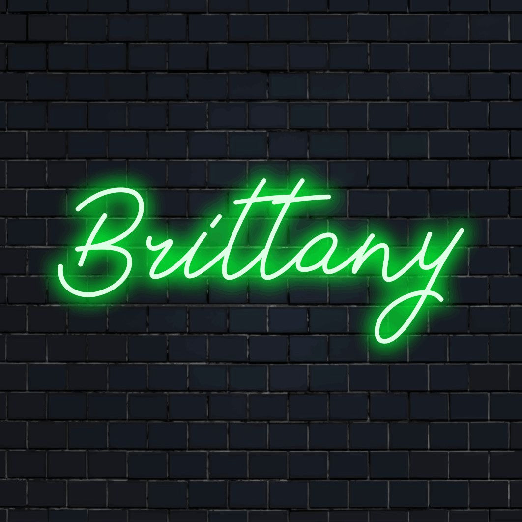Brittany LED Neon Sign, bright neon glow on dark brick wall
