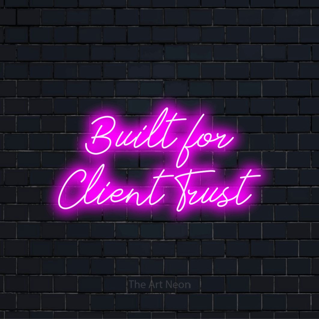 "Built For Client Trust" glowing LED neon sign on a black brick wall