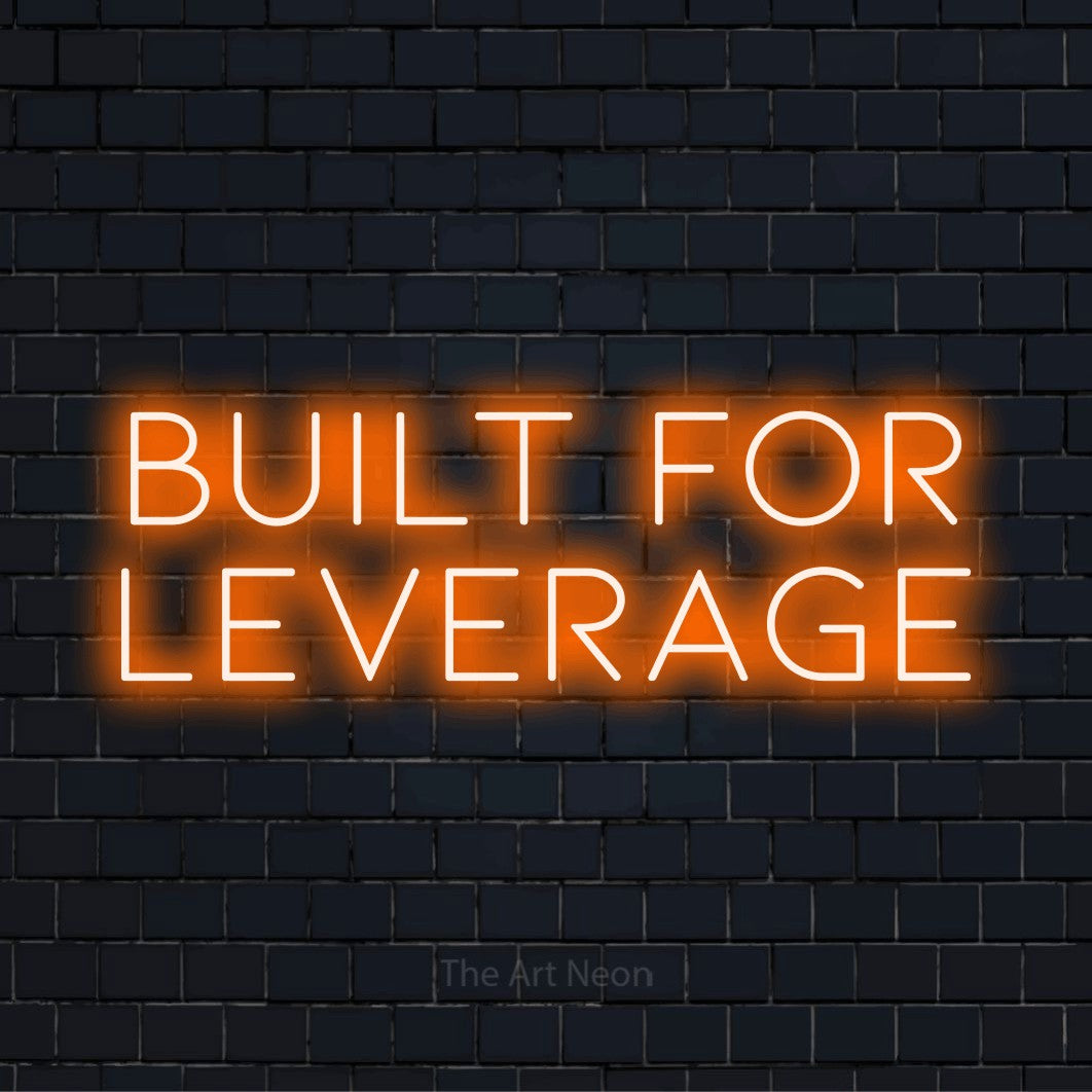 "Built For Leverage" text design with neon effect on a black brick wall