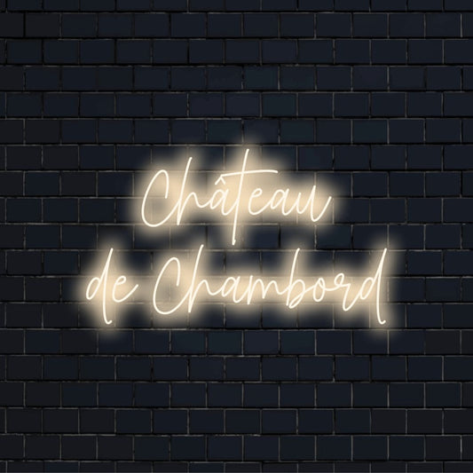 Ch Teau De Chambord Neon Sign, soft neon glow on dark brick wall