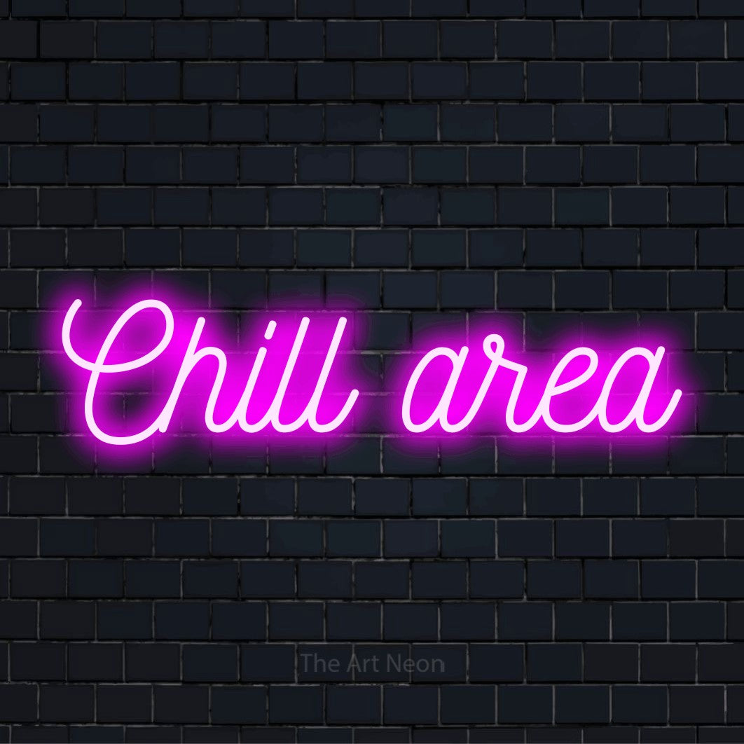 "Chill Area" script-style LED neon sign on a black brick wall