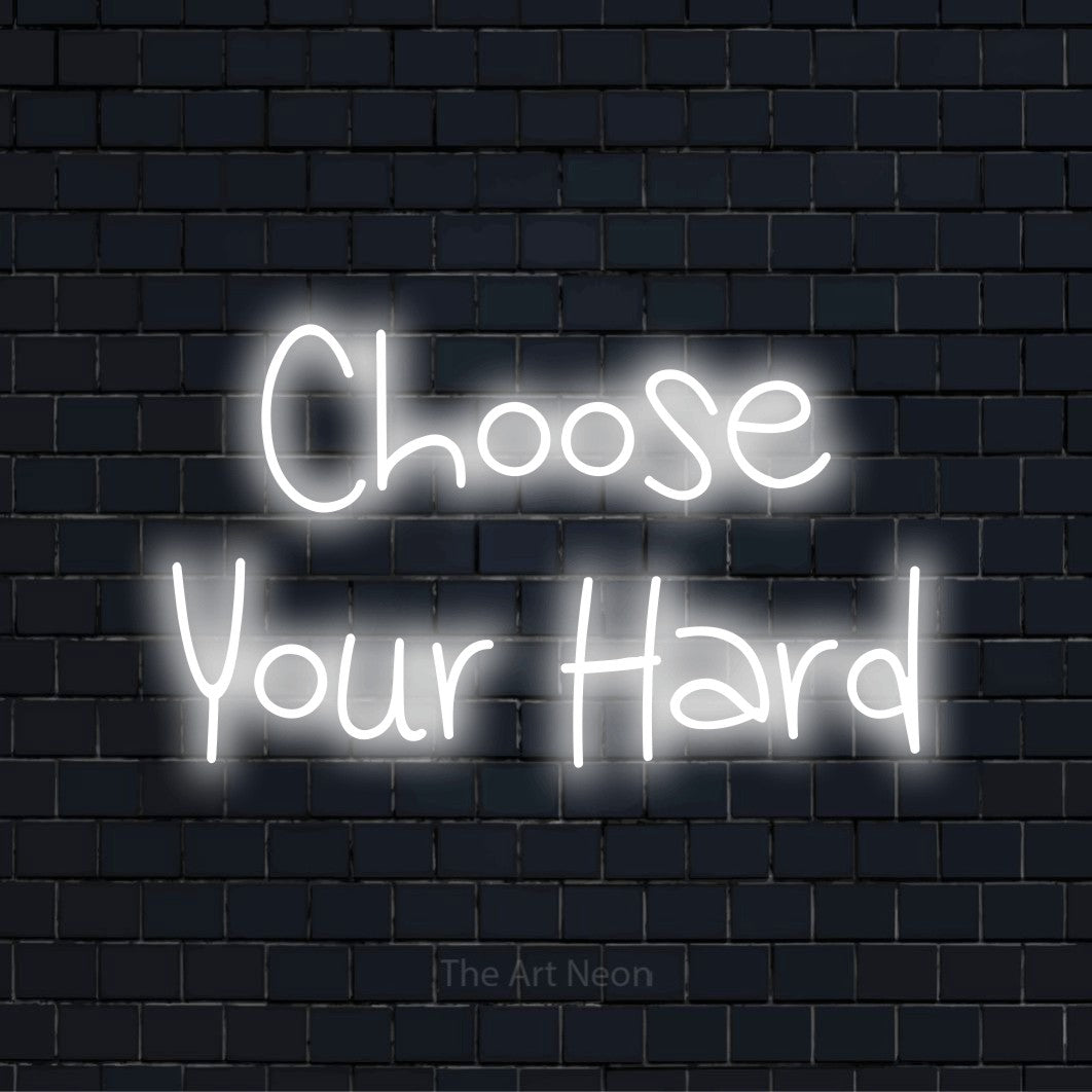 "Choose Your Hard" LED neon sign on a black brick wall