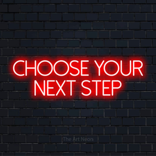 "Choose Your Next Step" script-style LED neon sign on a black brick wall