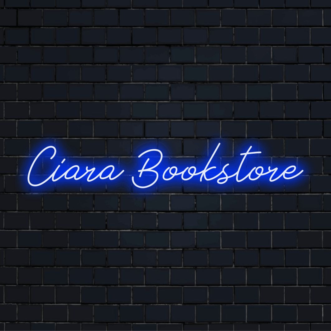 Ciara Bookstore Personalized Neon Light with glowing lettering against brick backdrop