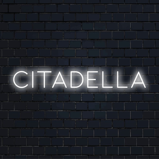 Citadella Neon Light with neon text light on black brick background