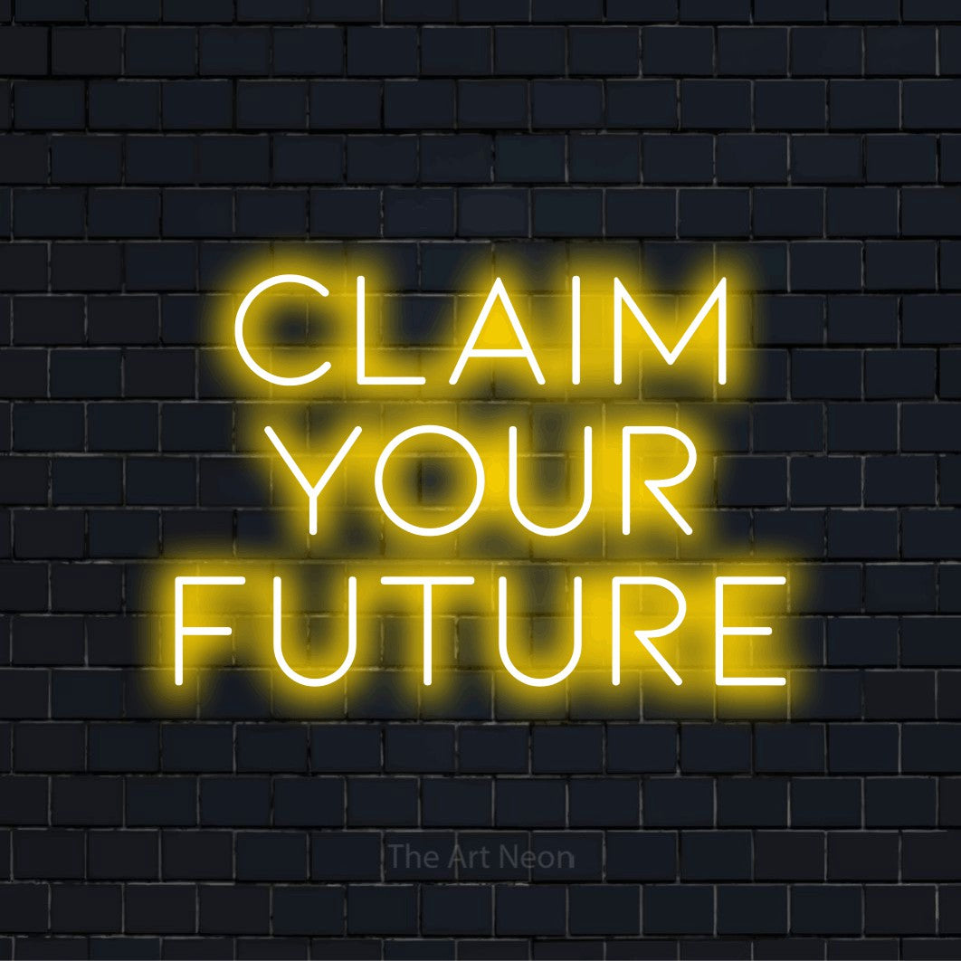 "Claim Your Future" LED neon sign on a black brick wall