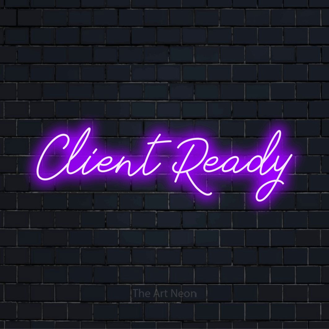 "Client Ready" script-style LED neon sign on a black brick wall