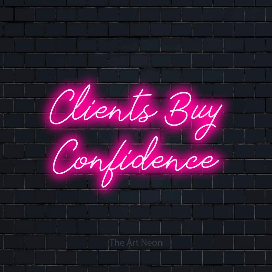 "Clients Buy Confidence" glowing LED neon sign on a black brick wall