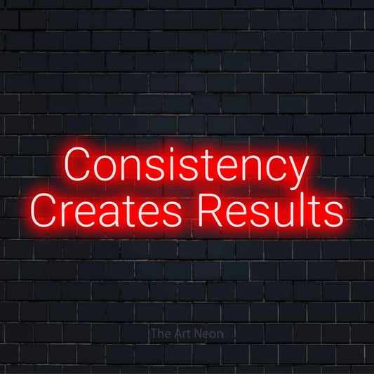 "Consistency Creates Results" glowing LED neon sign on a black brick wall