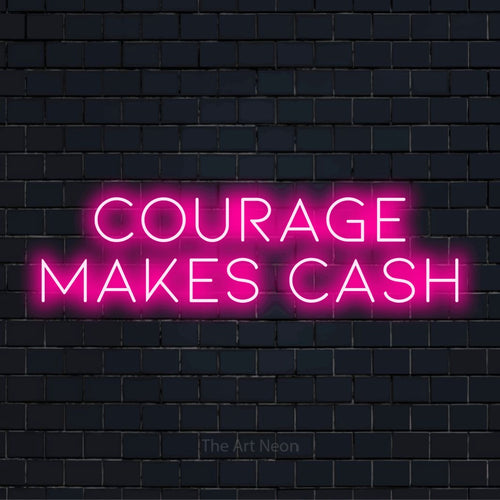 "Courage Makes Cash" text design with neon effect on a black brick wall