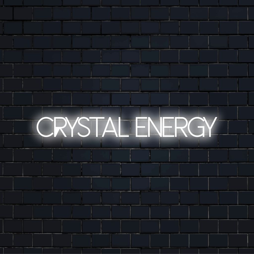 Crystal Energy LED Neon Sign, bright LED glow on dark brick wall