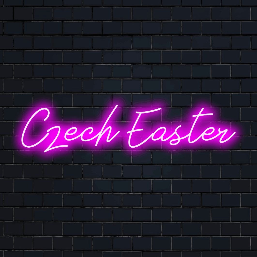 Czech Easter Neon Sign, bright neon lettering against black brick wall