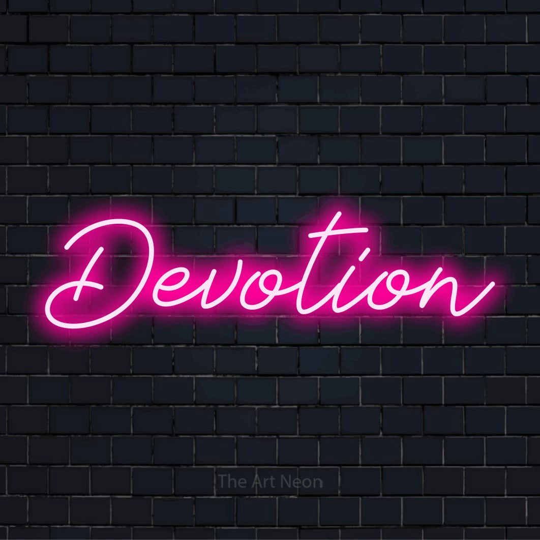 "Devotion" neon text design on a black brick wall