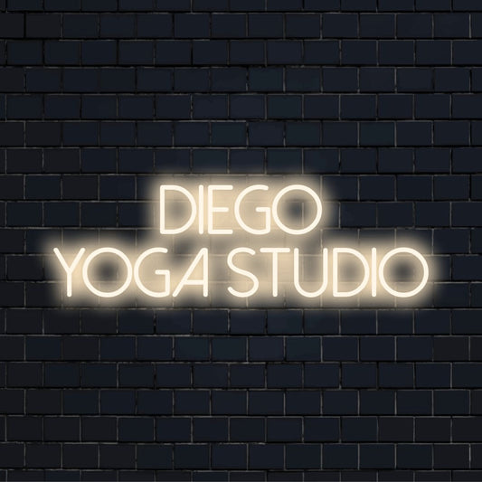 Diego Yoga Studio Custom Name Neon Sign, glowing wall decor against brick backdrop
