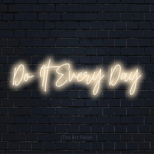 "Do It Every Day" glowing LED neon sign on a black brick wall