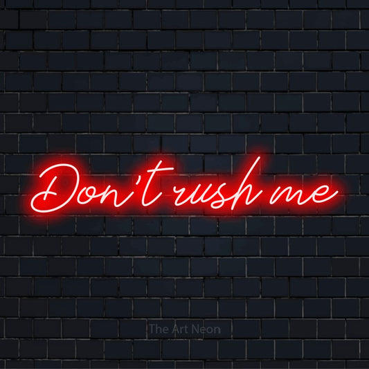 "Don’t Rush Me" LED neon sign on a black brick wall
