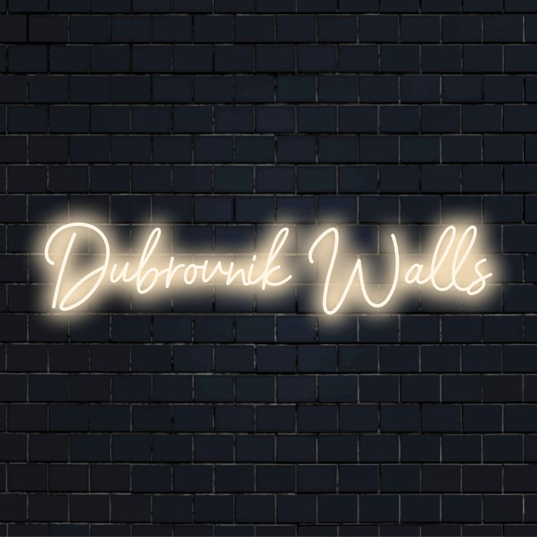 Dubrovnik Walls Neon Sign, glowing neon text against brick backdrop