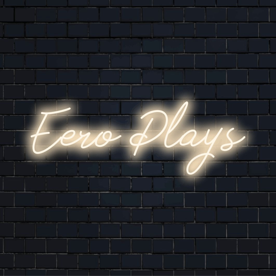 Eero Plays Personalized Neon Light with glowing wall decor against brick backdrop