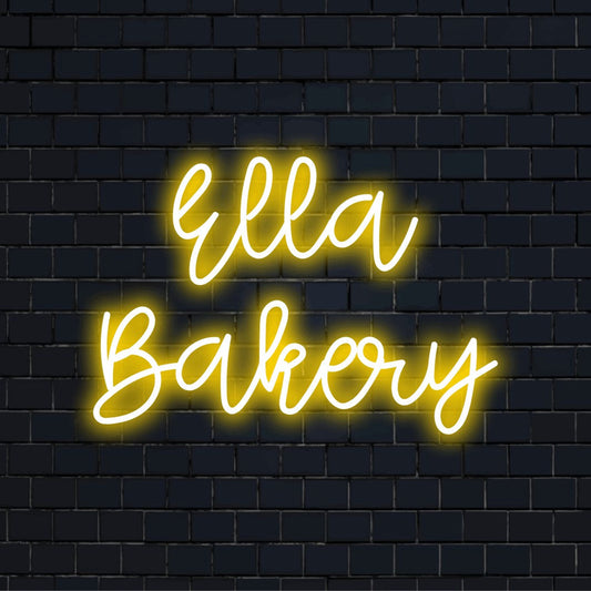 Ella Bakery Personalized LED Neon Sign, bright neon lettering against brick backdrop