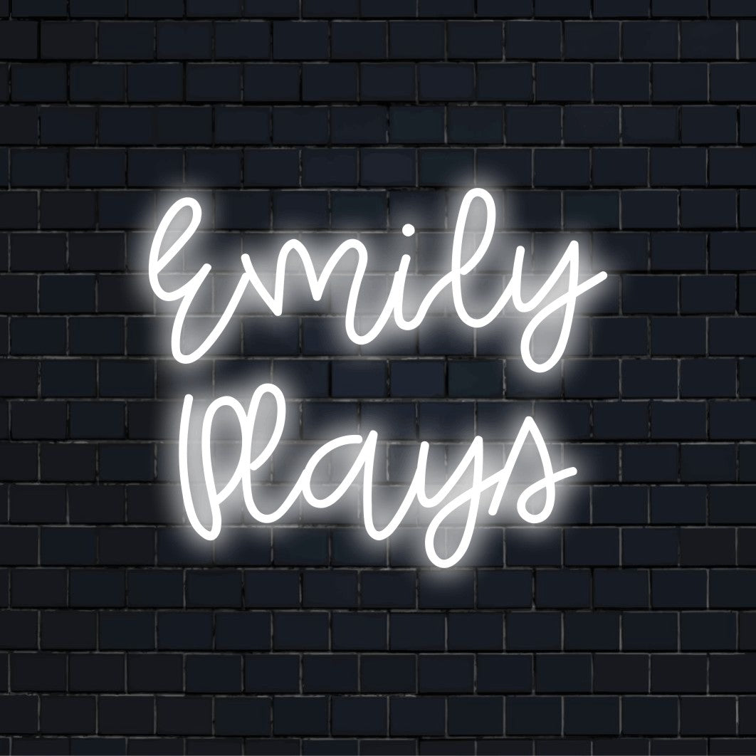 Emily Plays Custom Name Neon Sign, bright neon lettering on dark brick background