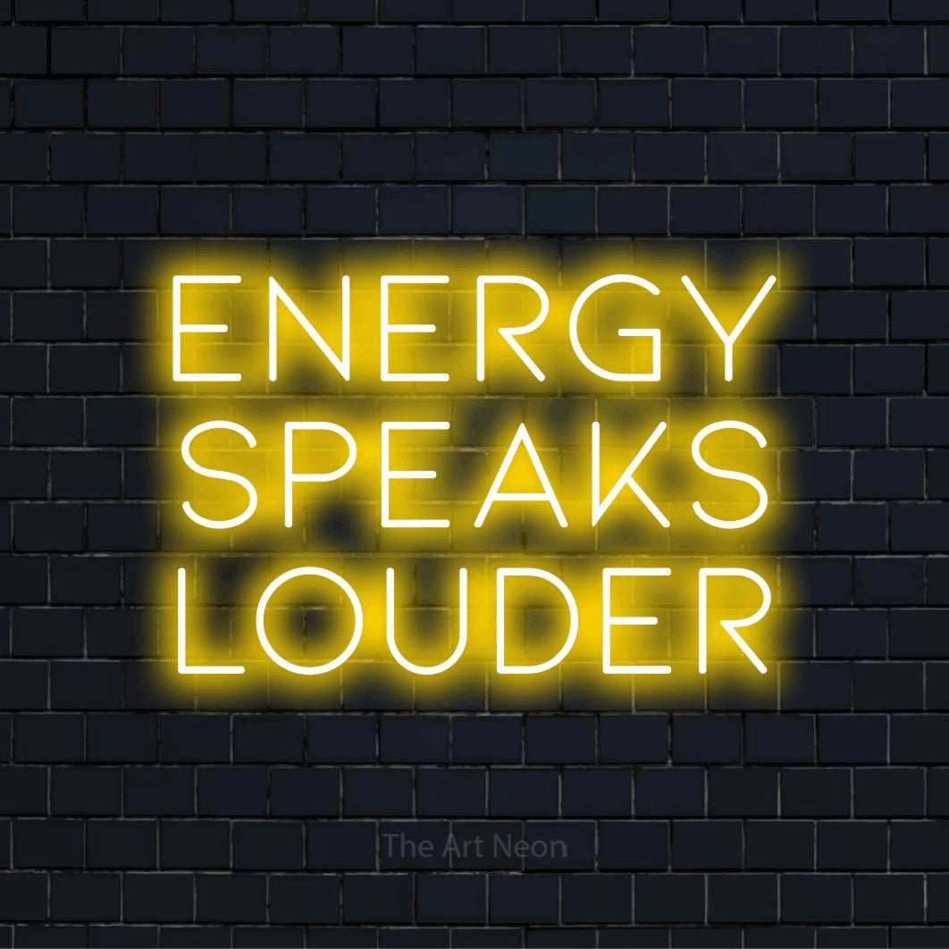 "Energy Speaks Louder" glowing LED neon sign on a black brick wall
