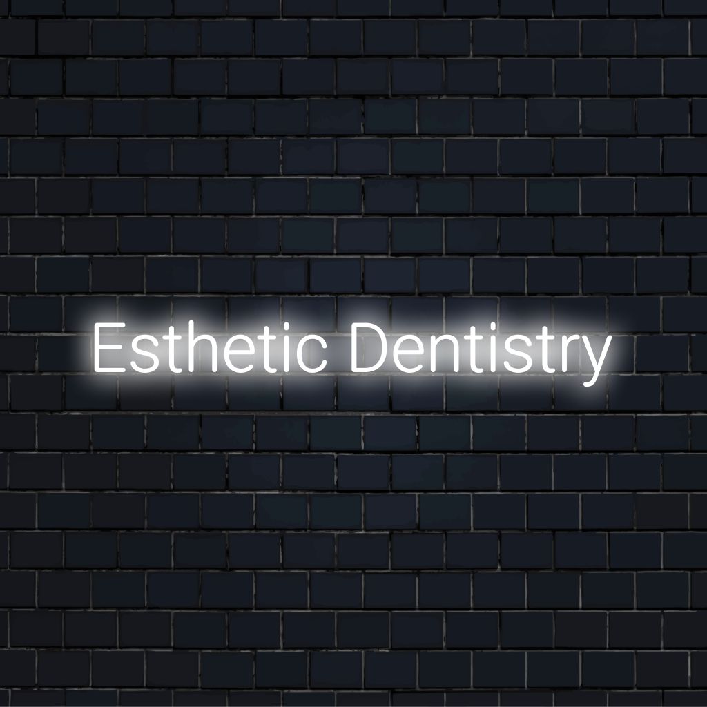 Esthetic Dentistry Neon Sign, bright neon lettering on dark brick wall