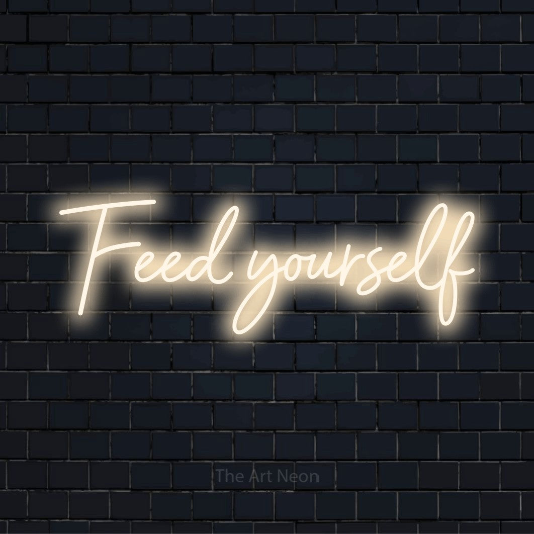 "Feed Yourself" text design with neon effect on a black brick wall
