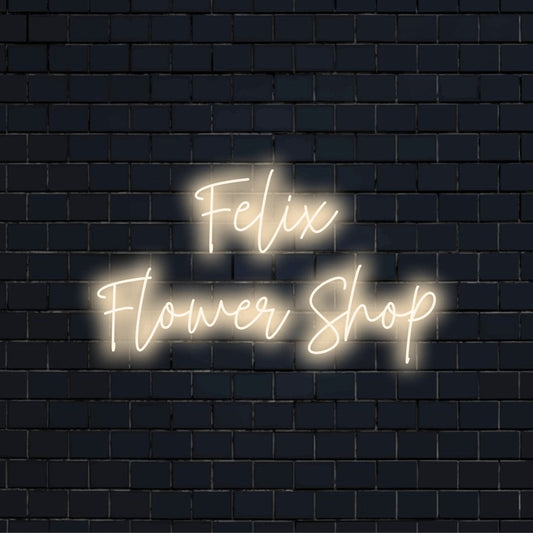 Felix Flower Shop Personalized LED Neon Sign, glowing neon text on black brick background