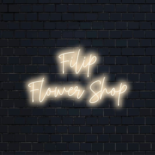 Filip Flower Shop Personalized LED Neon Sign, glowing wall decor against black brick wall