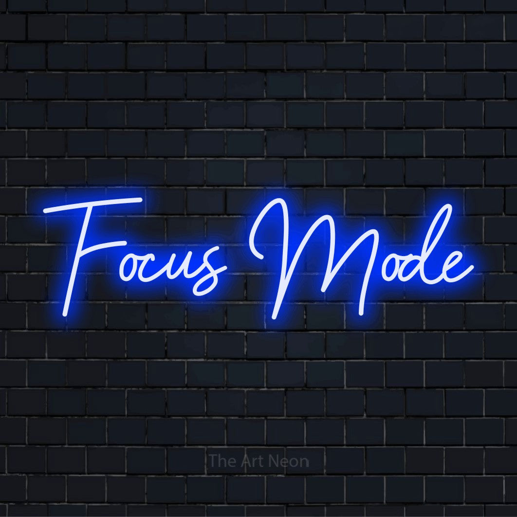 "Focus Mode" neon text design on a black brick wall