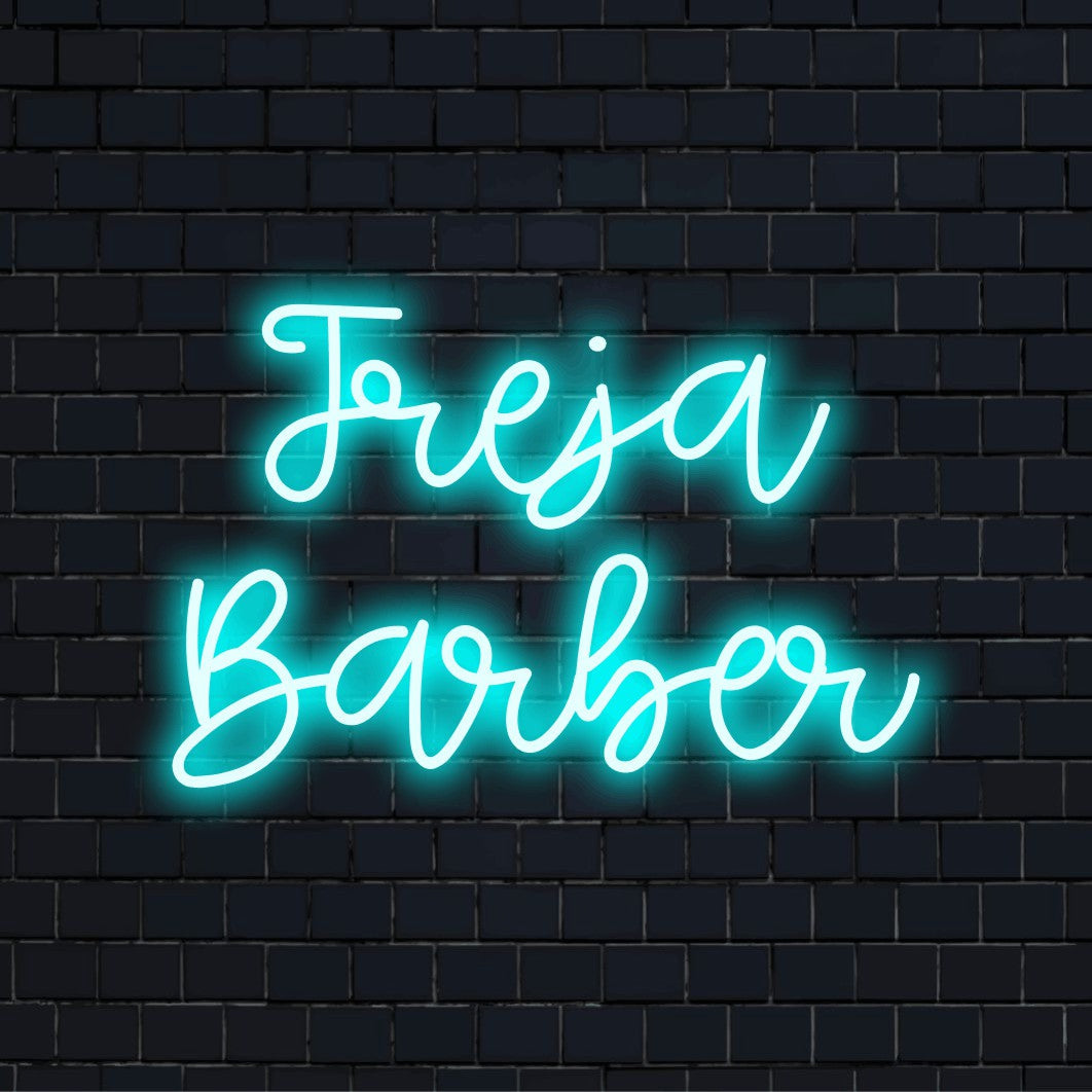 Freja Barber Personalized Neon Light with bright neon lettering on dark brick background
