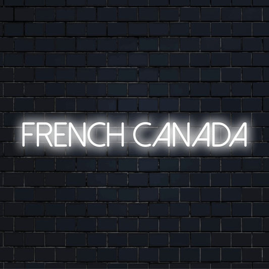 French Canada Neon Light with bright LED glow against brick backdrop