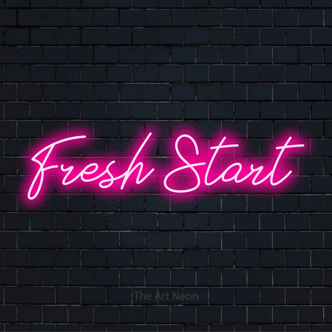 "Fresh Start" script-style LED neon sign on a black brick wall