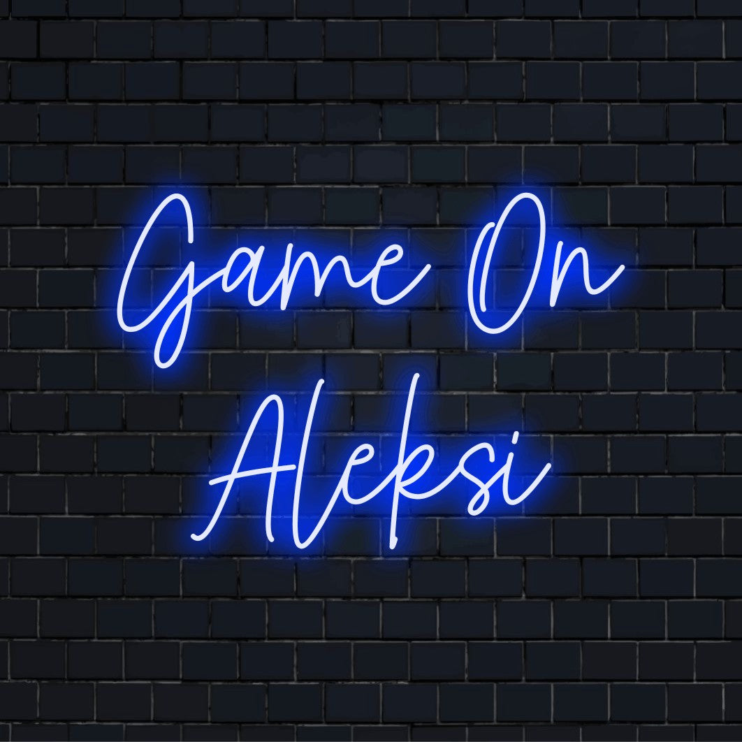 Game On Aleksi Personalized LED Neon Sign, bright neon lettering on dark brick wall