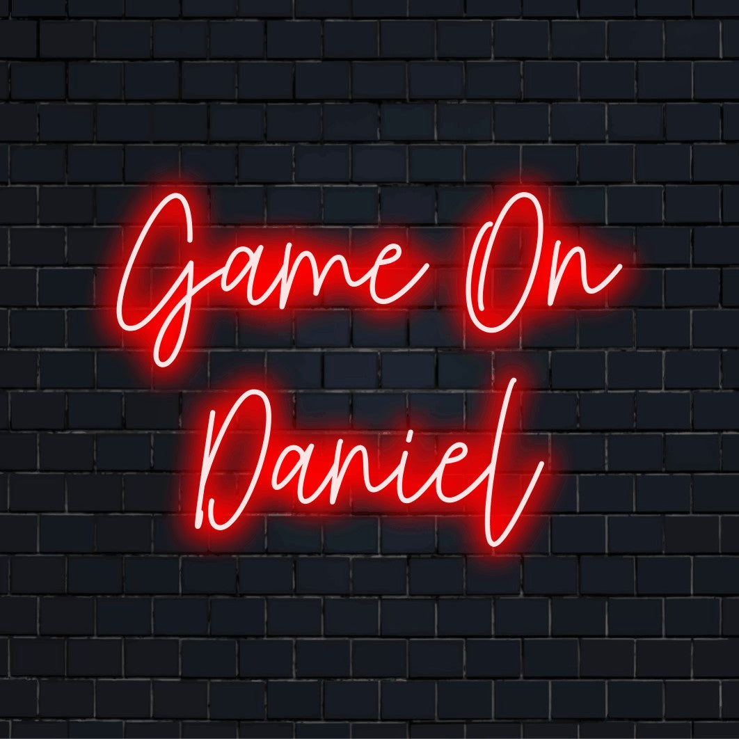 Game On Daniel Custom Name Neon Sign, bright LED glow on dark brick background