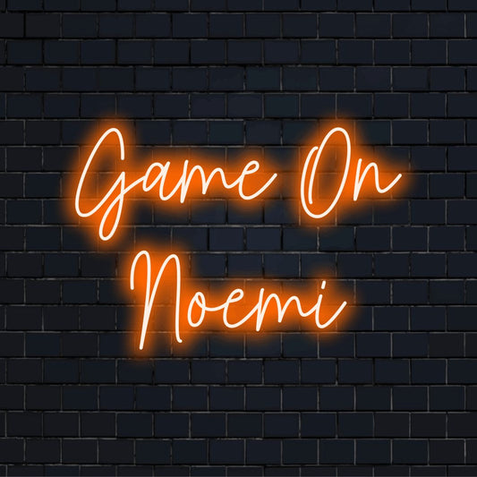 Game On Noemi Personalized Neon Light with glowing neon text on dark brick wall