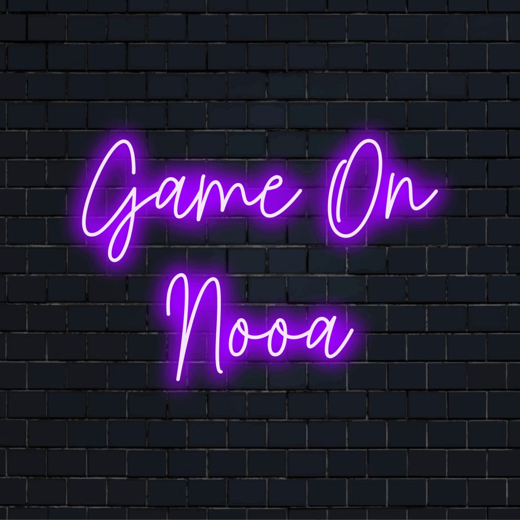 Game On Nooa Custom Name Neon Sign, glowing neon text on dark brick wall