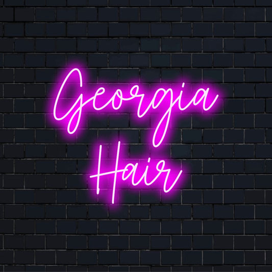 Georgia Hair Personalized Neon Light with soft neon glow against brick backdrop