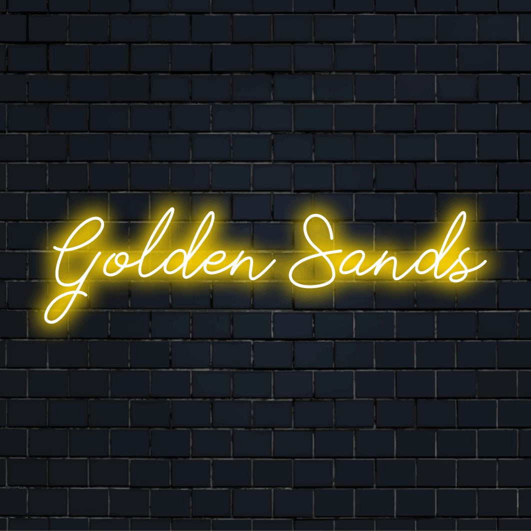 Golden Sands Neon Light with glowing neon text on dark brick background