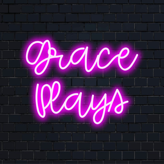 Grace Plays Personalized LED Neon Sign, glowing wall decor on dark brick wall
