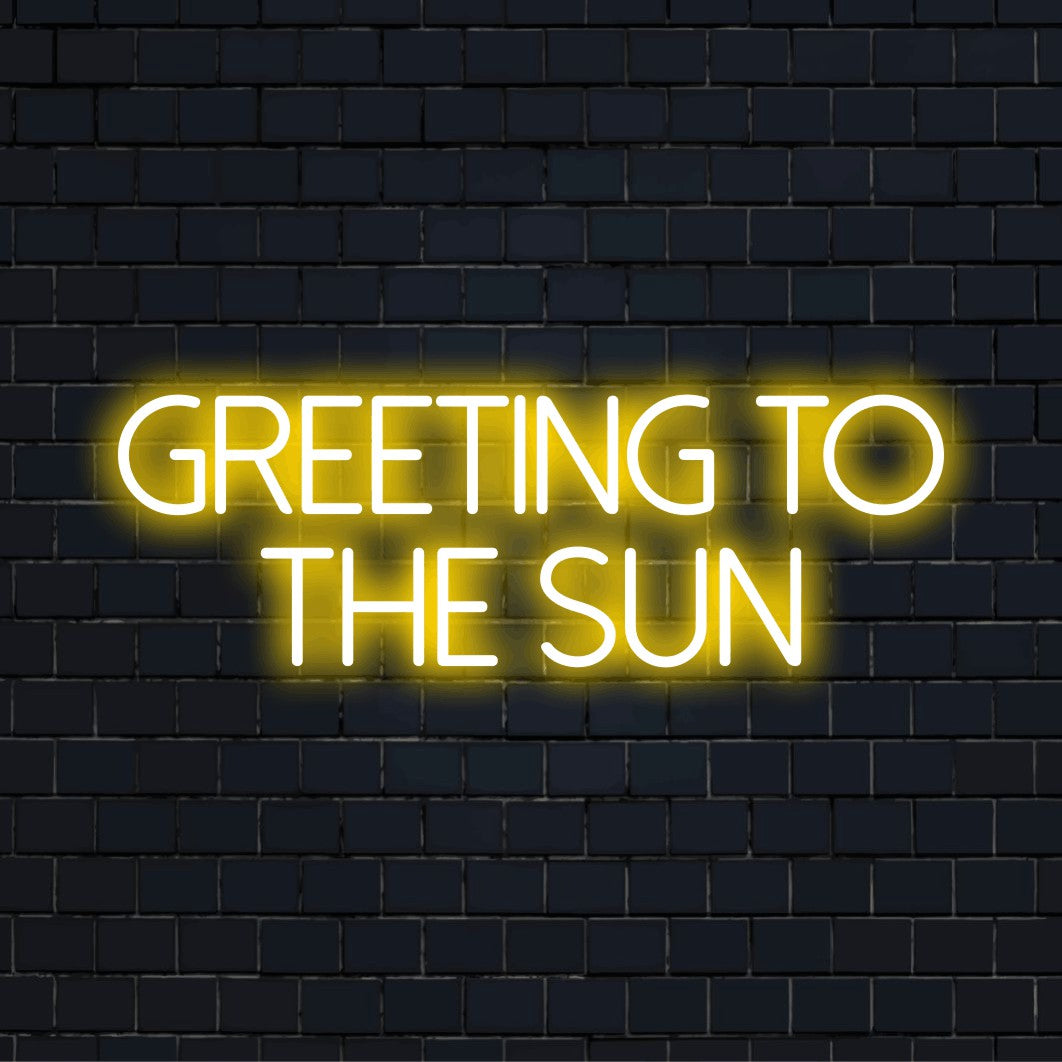 Greeting To The Sun Neon Sign, bright neon lettering on dark brick wall
