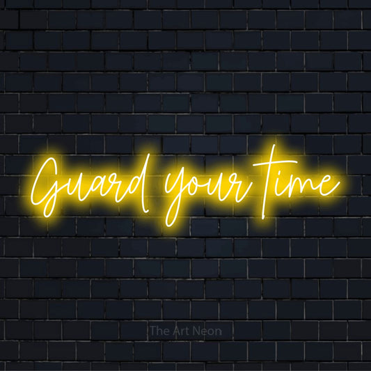 "Guard Your Time" LED neon sign on a black brick wall
