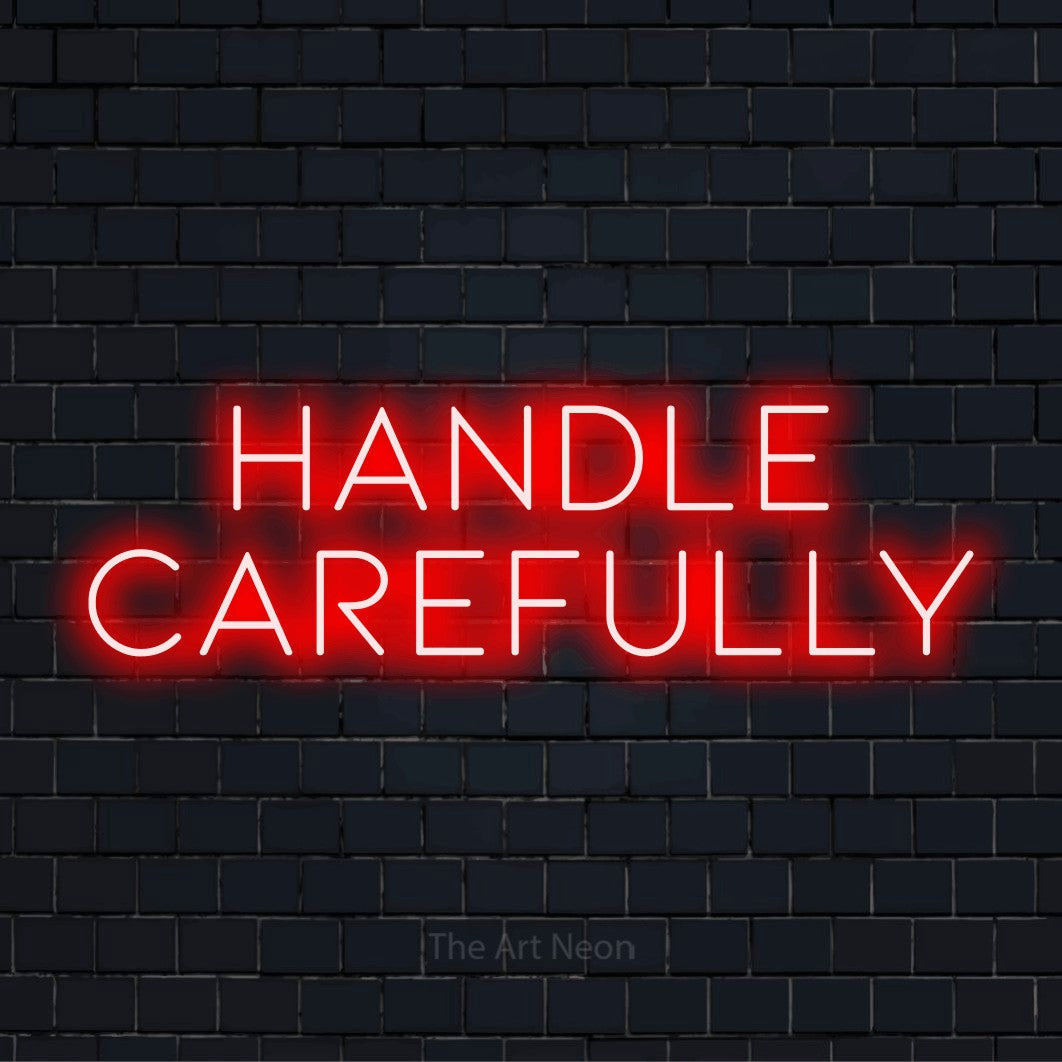 "Handle Carefully" neon text design on a black brick wall