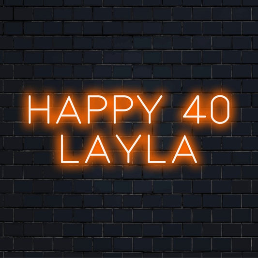 Happy 40 Layla Personalized LED Neon Sign, bright neon glow against brick backdrop